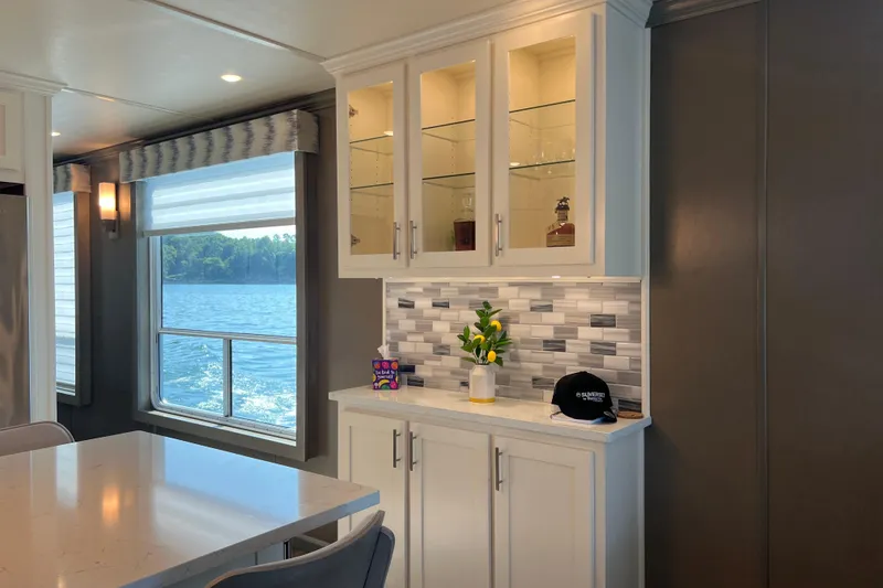 Slide: The Image of Modern Sumerset Luxe II 2026 interior with lake view, elegant cabinetry, and stylish decor. - 5