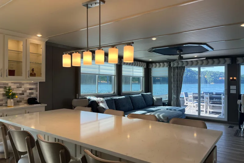 Slide: The Image of Luxurious Sumerset Luxe II 2026 houseboat interior with modern kitchen and scenic lake view. - 9