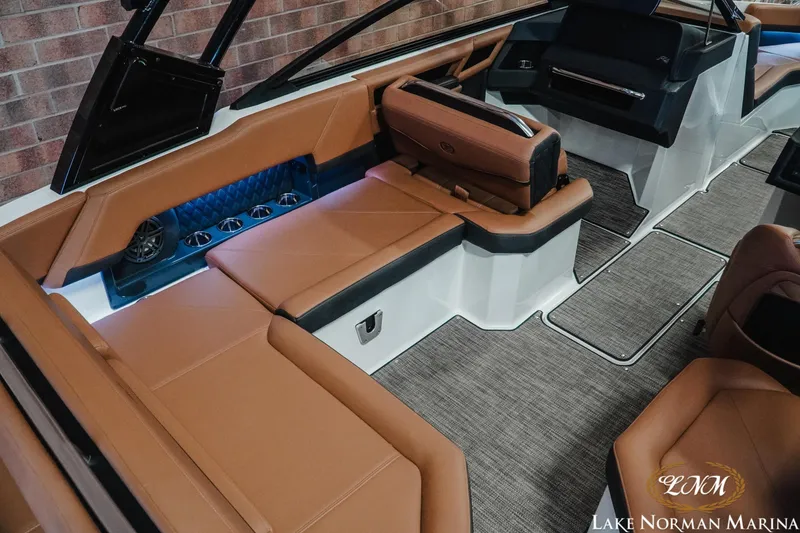 Slide: The Image of Luxurious interior of 2025 Cobalt R4 boat with brown leather seating and modern design. - 10