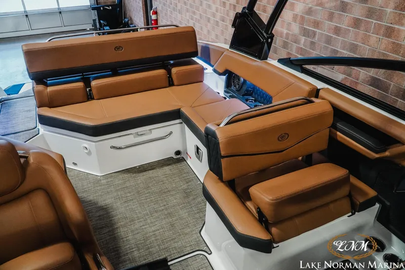 Slide: The Image of Luxurious interior of 2025 Cobalt R4 boat with tan leather seating at Lake Norman Marina. - 17