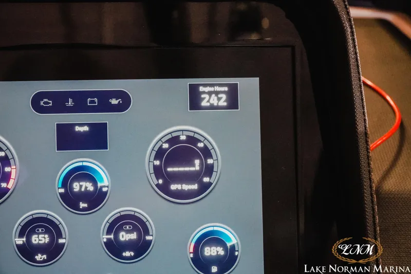 Slide: The Image of Dashboard display of a 2025 Cobalt R4 boat showing engine hours and gauges. - 21