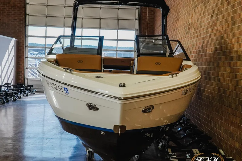 Slide: The Image of 2025 Cobalt R4 boat in showroom, featuring sleek design and modern amenities. - 4