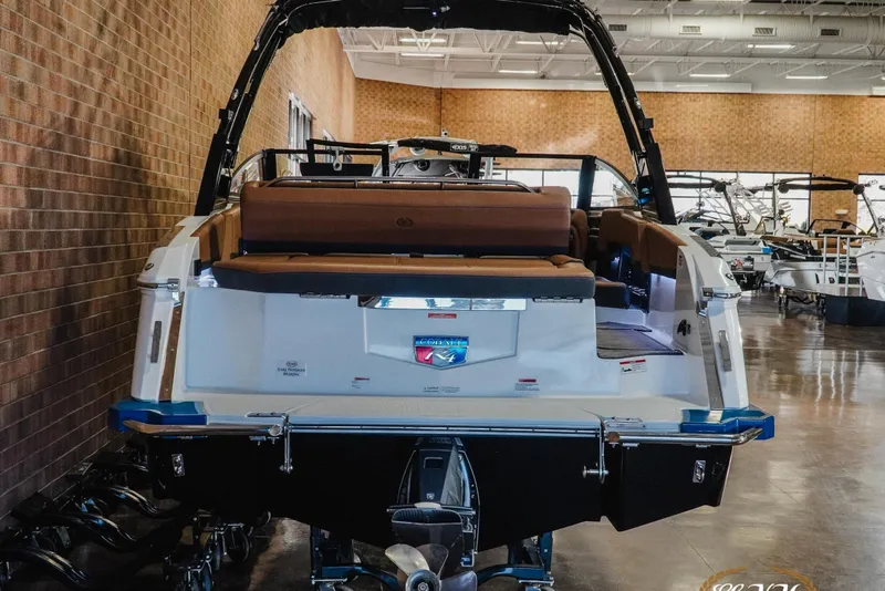 Slide: The Image of 2025 Cobalt R4 boat displayed indoors, showcasing sleek design and luxurious seating. - 6