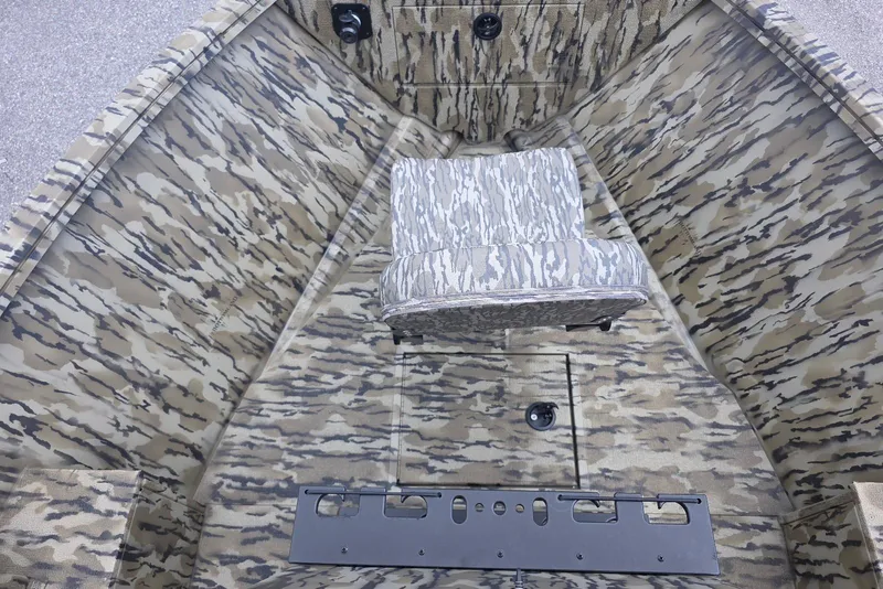 Slide: The Image of 2026 Smoker Craft Freedom 180 CC boat interior with camouflage design and seating. - 13