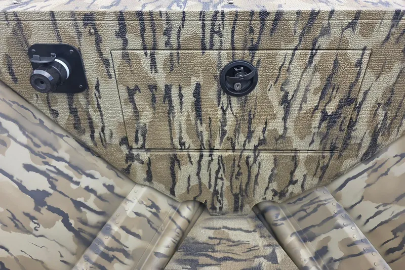 Slide: The Image of Camouflage-patterned panel on 2026 Smoker Craft Freedom 180 CC boat. - 14