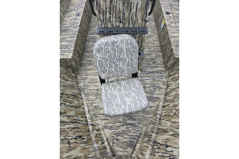 Slide: The Image of 2026 Smoker Craft Freedom 180 CC boat with camouflage seating and interior design. - 16