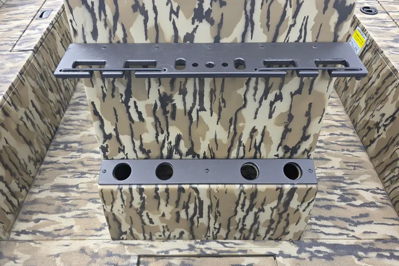 Slide: The Image of 2026 Smoker Craft Freedom 180 CC boat with camouflage interior and rod holders. - 17