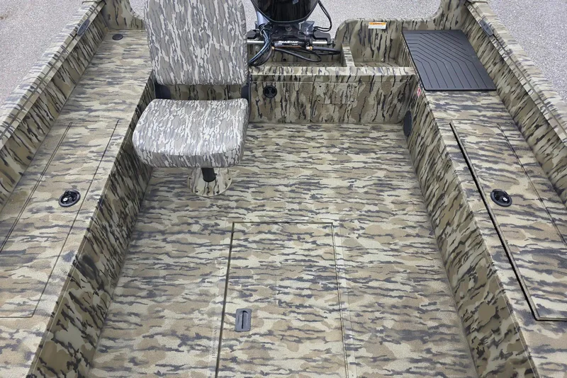 Slide: The Image of 2026 Smoker Craft Freedom 180 CC boat interior with camouflage design and seating. - 23