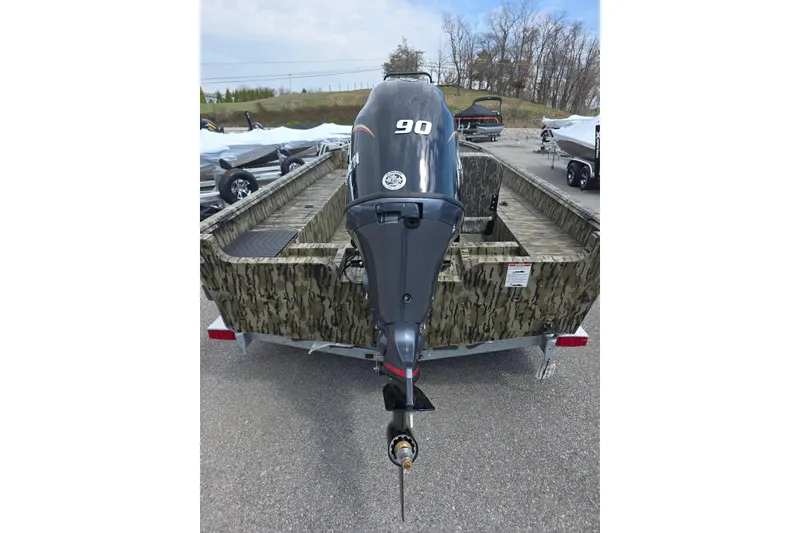 Slide: The Image of 2026 Smoker Craft Freedom 180 CC boat with camouflage design and 90 HP outboard motor. - 6