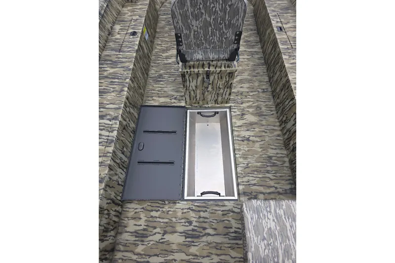 Slide: The Image of 2026 Smoker Craft Freedom 180 CC boat interior with camouflage design and storage compartments. - 8