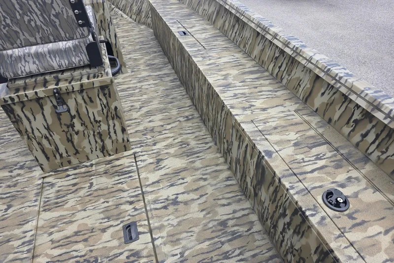 Slide: The Image of 2026 Smoker Craft Freedom 180 CC boat interior with camouflage pattern design. - 9