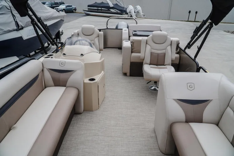 Slide: The Image of 2018 Godfrey SWEETWATER 2386 DT pontoon boat with beige seating and spacious interior. - 13