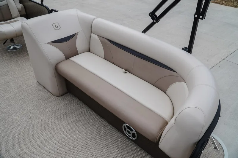 Slide: The Image of Luxurious seating on 2018 Godfrey SWEETWATER 2386 DT pontoon boat, featuring beige upholstery. - 15