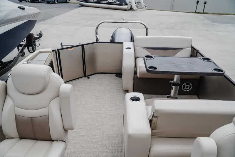 Slide: The Image of 2018 Godfrey SWEETWATER 2386 DT pontoon boat interior with seating and table. - 17