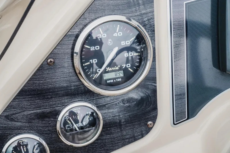 Slide: The Image of Dashboard of 2018 Godfrey SWEETWATER 2386 DT with speedometer and voltmeter gauges. - 20