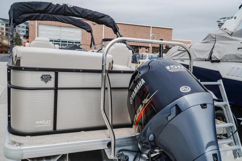 Slide: The Image of 2018 Godfrey SWEETWATER 2386 DT pontoon boat with Yamaha 150 engine at dock. - 4