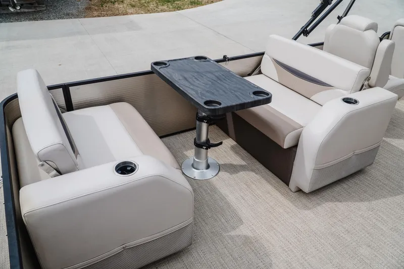 Slide: The Image of 2018 Godfrey SWEETWATER 2386 DT boat interior with seating and table. - 7