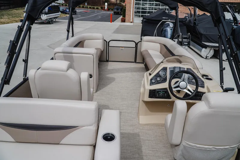 Slide: The Image of Interior view of a 2018 Godfrey SWEETWATER 2386 DT pontoon boat with beige seating. - 8