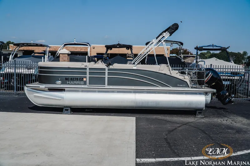 The Image of 2023 Harris Cruiser 210 pontoon boat at Lake Norman Marina, side view. - 1