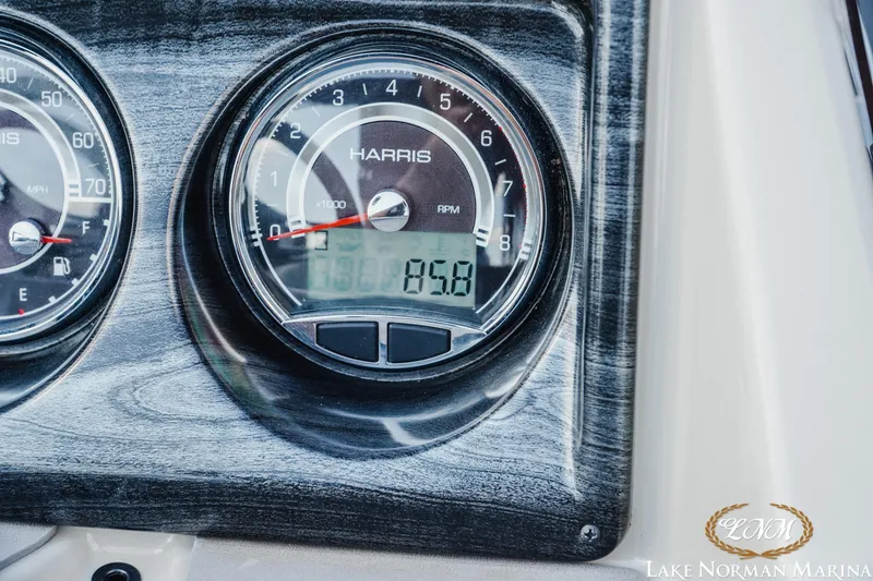 Slide: The Image of Dashboard of 2023 Harris Cruiser 210 showing RPM and speed gauges. - 15