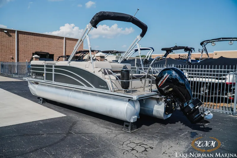 Slide: The Image of 2023 Harris Cruiser 210 pontoon boat displayed at Lake Norman Marina. - 3