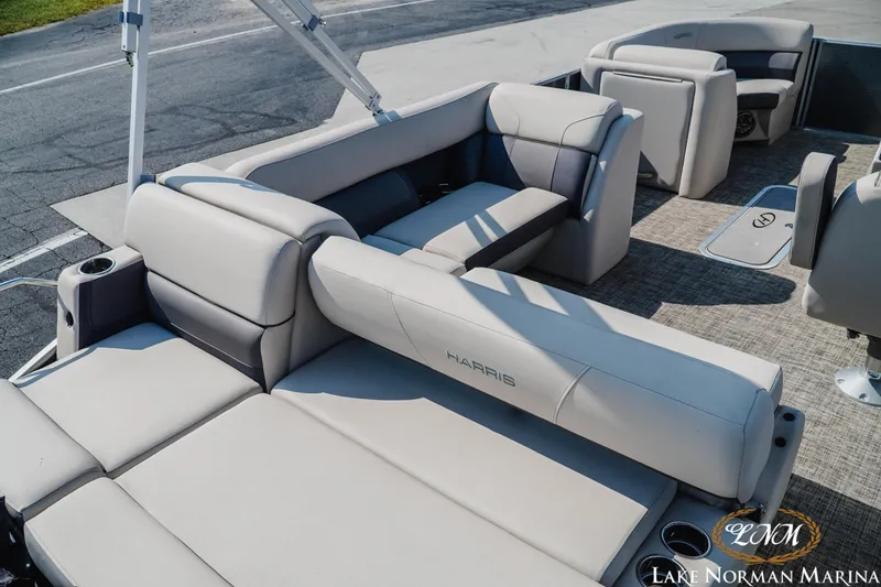 Slide: The Image of 2023 Harris Cruiser 210 pontoon boat interior with plush seating and modern design. - 6
