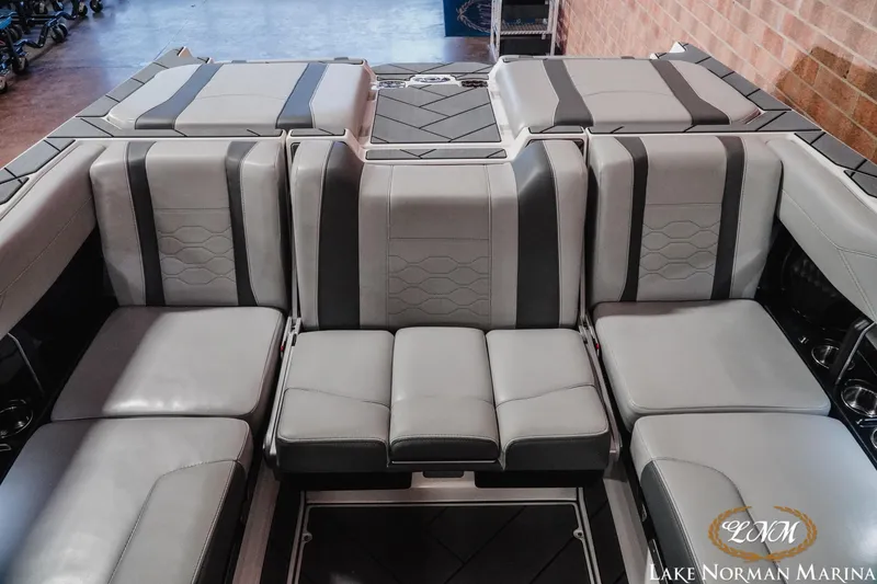 Slide: The Image of 2025 Malibu Wakesetter 23 LSV interior seating, luxurious gray upholstery, Lake Norman Marina. - 16