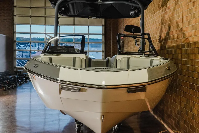 Slide: The Image of 2025 Malibu Wakesetter 23 LSV boat in showroom, front view. - 4