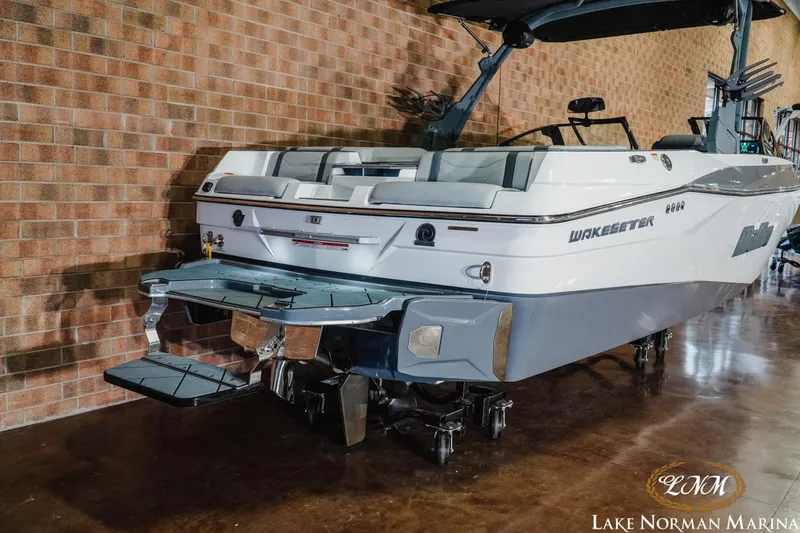 Slide: The Image of 2025 Malibu Wakesetter 23 LSV boat displayed indoors at Lake Norman Marina. - 6