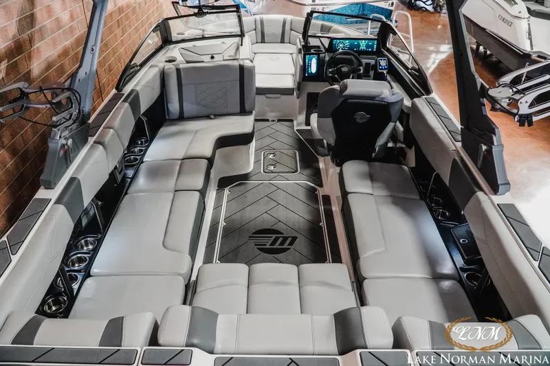 Slide: The Image of 2025 Malibu Wakesetter 23 LSV interior with luxurious seating and modern dashboard. - 9