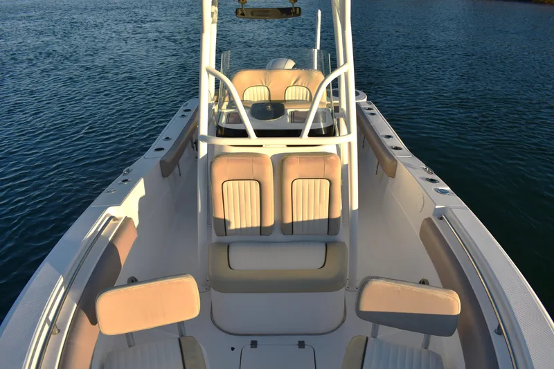 Slide: The Image of 2018 Sea Fox 226 Commander boat interior with seating, on calm water. - 11