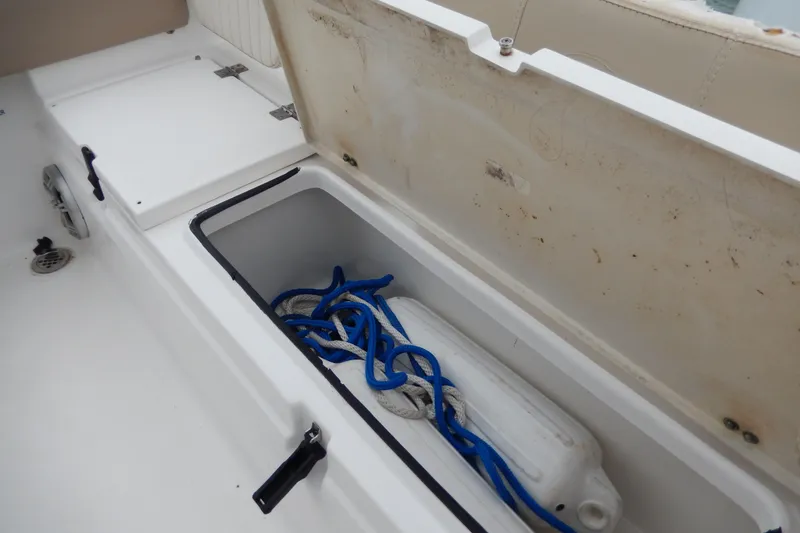 Slide: The Image of Open storage compartment on 2018 Sea Fox 226 Commander boat with blue rope and fender. - 17