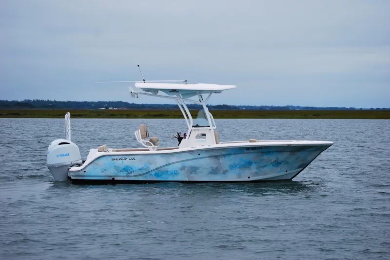 Slide: The Image of 2018 Sea Fox 226 Commander boat on calm water with Yamaha engine. - 5