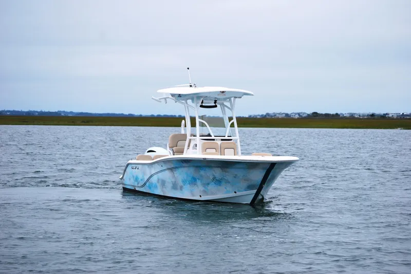 Slide: The Image of 2018 Sea Fox 226 Commander boat on calm water, overcast sky. - 6