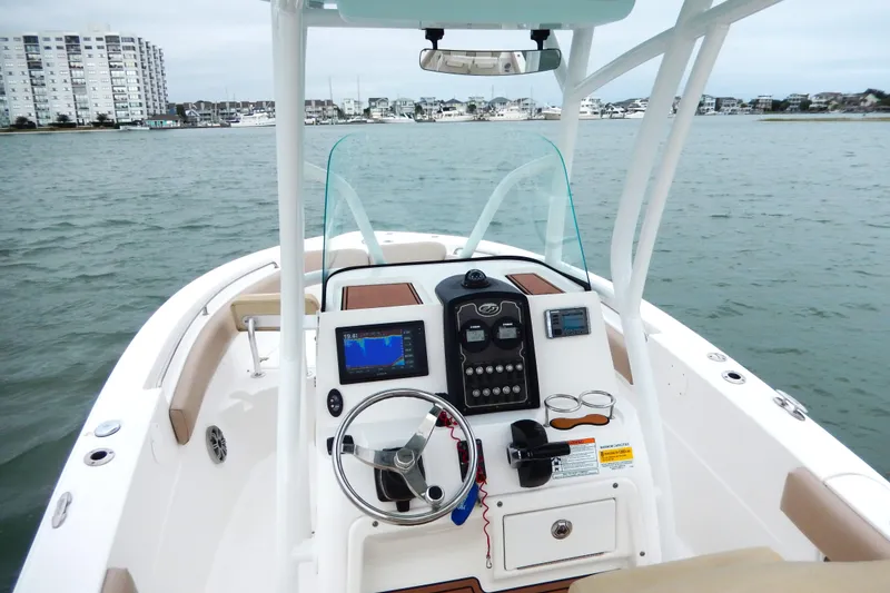 Slide: The Image of 2018 Sea Fox 226 Commander boat dashboard with steering wheel and navigation system. - 7