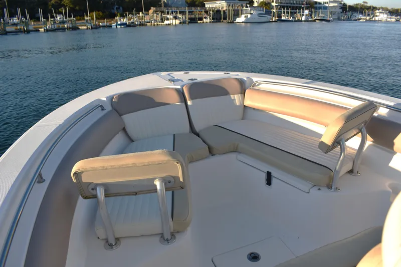 Slide: The Image of 2018 Sea Fox 226 Commander boat with spacious seating area on calm water. - 9