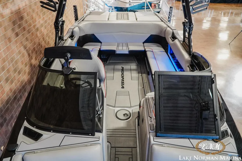 Slide: The Image of 2023 Moomba Max boat interior with sleek seating and modern design at Lake Norman Marina. - 15