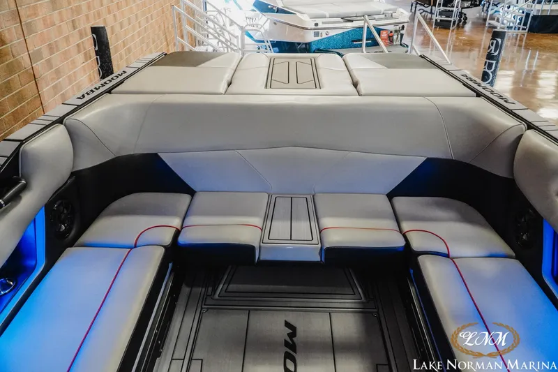 Slide: The Image of 2023 Moomba Max boat interior with sleek gray seating and modern design at Lake Norman Marina. - 18