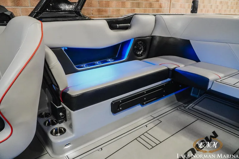 Slide: The Image of 2023 Moomba Max boat interior with illuminated seating and cup holders. - 19