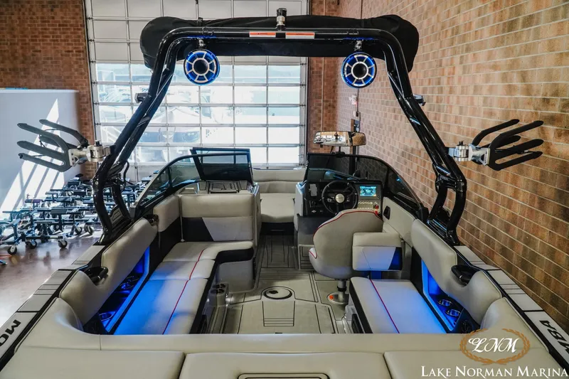 Slide: The Image of 2023 Moomba Max boat interior with modern seating and advanced audio system at Lake Norman Marina. - 7