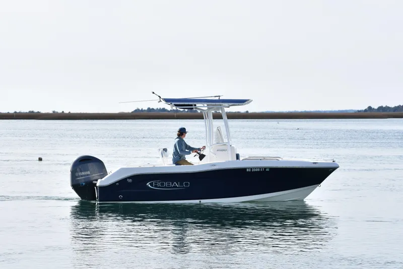The Image of 2021 Robalo R180 Center Console boat on calm water with Yamaha engine. - 0