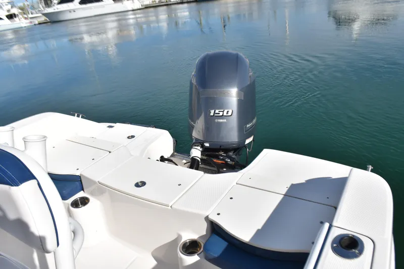 Slide: The Image of 2021 Robalo R180 Center Console boat with Yamaha 150 engine on calm water. - 10
