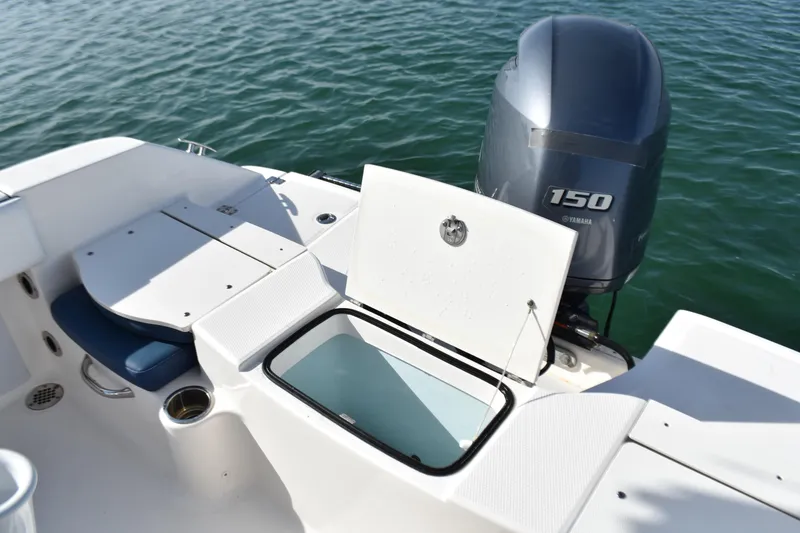 Slide: The Image of 2021 Robalo R180 Center Console boat with Yamaha 150 engine on water. - 11