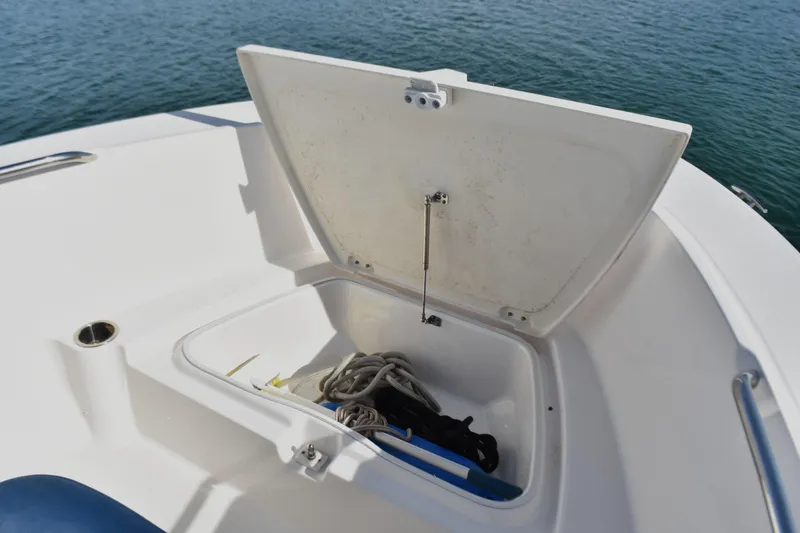 Slide: The Image of Open storage compartment on 2021 Robalo R180 Center Console boat. - 6