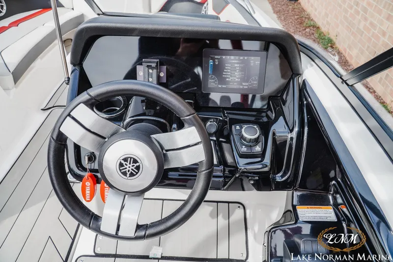 Slide: The Image of Steering console of 2020 Yamaha Boats 212X with digital display and controls. - 11