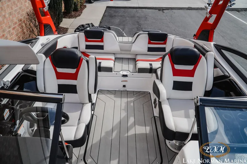 Slide: The Image of 2020 Yamaha Boats 212X interior with red and black seating, Lake Norman Marina. - 15