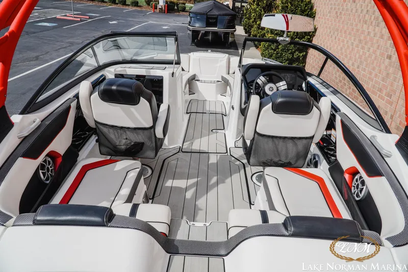 Slide: The Image of 2020 Yamaha Boats 212X interior with sleek seating and modern dashboard design. - 5