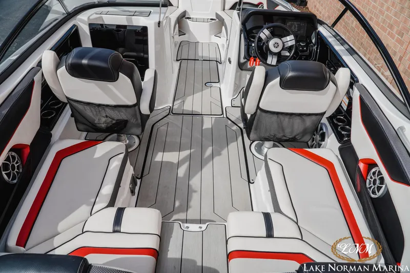 Slide: The Image of 2020 Yamaha Boats 212X interior with sleek seating and modern dashboard design. - 6