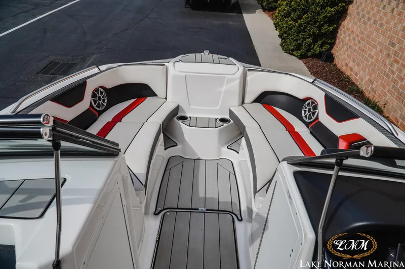 Slide: The Image of 2020 Yamaha Boats 212X interior with sleek seating and modern design at Lake Norman Marina. - 8