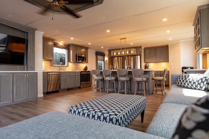 Slide: The Image of Luxurious 2026 Sumerset Luxe III houseboat interior with modern kitchen and stylish seating area. - 11